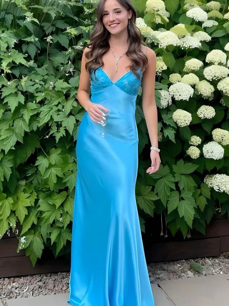 Front view of a sky blue satin prom dress with a deep V-neck and lace-up detail.