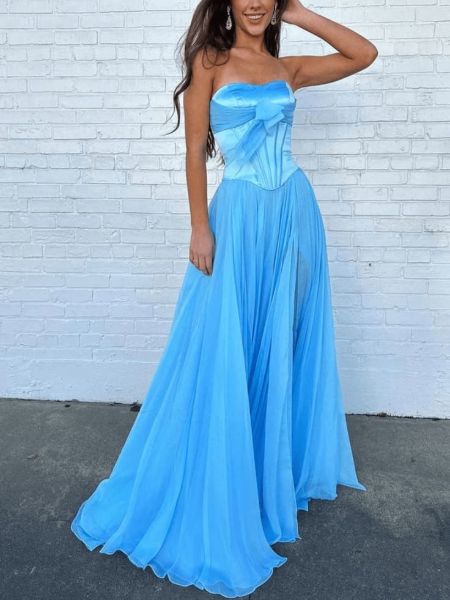 Front view of a sky blue strapless prom dress in flowy chiffon with a structured corset bodice.