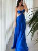 Front view of a royal blue satin prom dress with spaghetti straps, featuring a bow and cutout design.