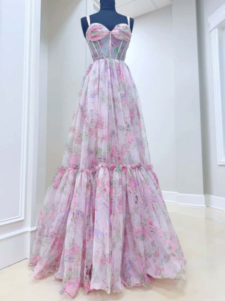 Front view of a floral print A-line prom dress with delicate thin straps.