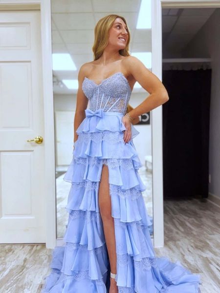 Front view of a sweetheart A-line prom dress with a tiered skirt and delicate bead embellishments.