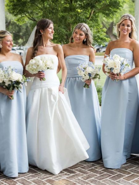 Front view of a simple light blue satin strapless bridesmaid dress.