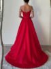 Back view of the red dress, showcasing the off-the-shoulder sleeves and fitted silhouette.