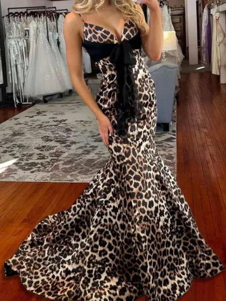 Leopard print mermaid prom dress with thin straps, showing the fitted bodice and flared skirt.