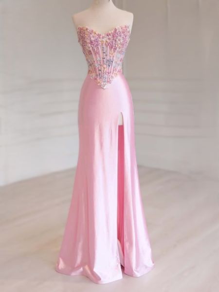 Blush pink strapless prom dress with a detailed 3D floral appliqué corset bodice.