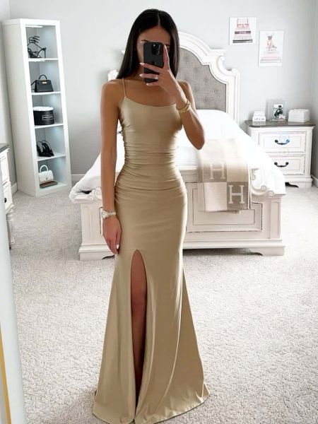 Elegant champagne satin prom dress with thin spaghetti straps and a sleek silhouette.
