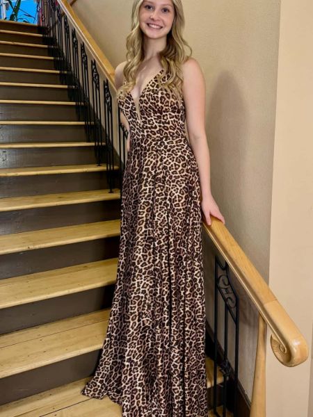 Bold leopard print prom dress with a daring plunge neckline and fitted silhouette.