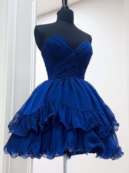 Royal blue strapless homecoming dress with a ruched, draped bodice and A-line skirt.