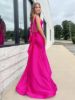 Side view of the hot pink mermaid dress, highlighting the trumpet flare at the knees.