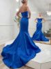 Side profile of the royal blue mermaid dress, showing the fitted hips and knee-level flare.