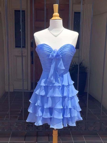 Strapless A-line homecoming dress with cascading ruffles on the bodice and skirt.
