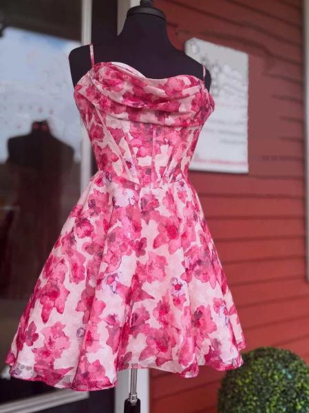 Romantic pink floral print homecoming dress with feminine silhouette and soft blooms.