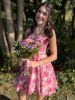 Model wearing the romantic pink floral dress, radiating soft elegance and charm.