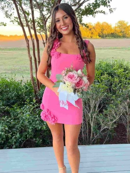 Hot pink bodycon homecoming dress with intricate 3D floral appliqué on the bodice.