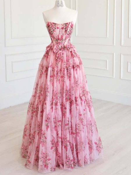 Pink floral strapless maxi dress with cascading ruffles and sweetheart neckline, flowing floor-length skirt.