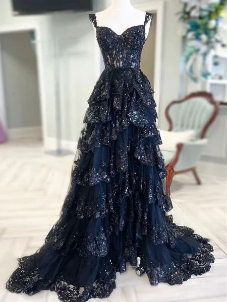 Sequins black lace prom dress with cascading ruffles, thigh-high slit, and sparkling embellishments.