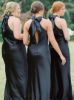 Back view of convertible strap black bridesmaid dress showing crisscross strap styling option.