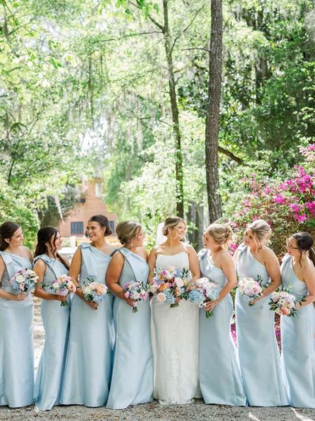 One-shoulder satin bridesmaid dress with elegant asymmetrical neckline and flowing silhouette.