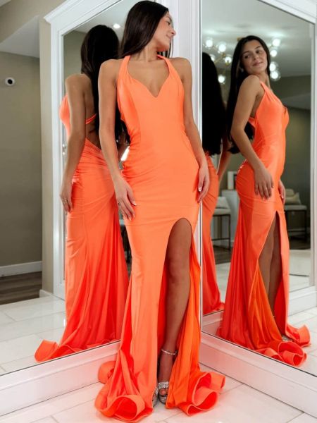 Orange halter mermaid prom dress with dramatic high slit, fitted silhouette, and elegant halter neckline.